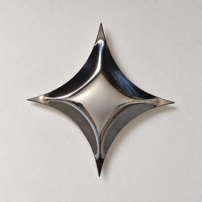 Astra Wall Sculpture — mirror-finish stainless steel four-point star wall decor by AERIS LIVING