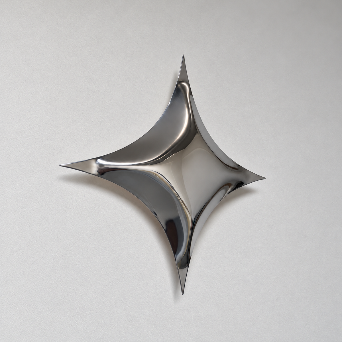 Astra Wall Sculpture — mirror-finish stainless steel four-point star wall decor by AERIS LIVING (view 3)