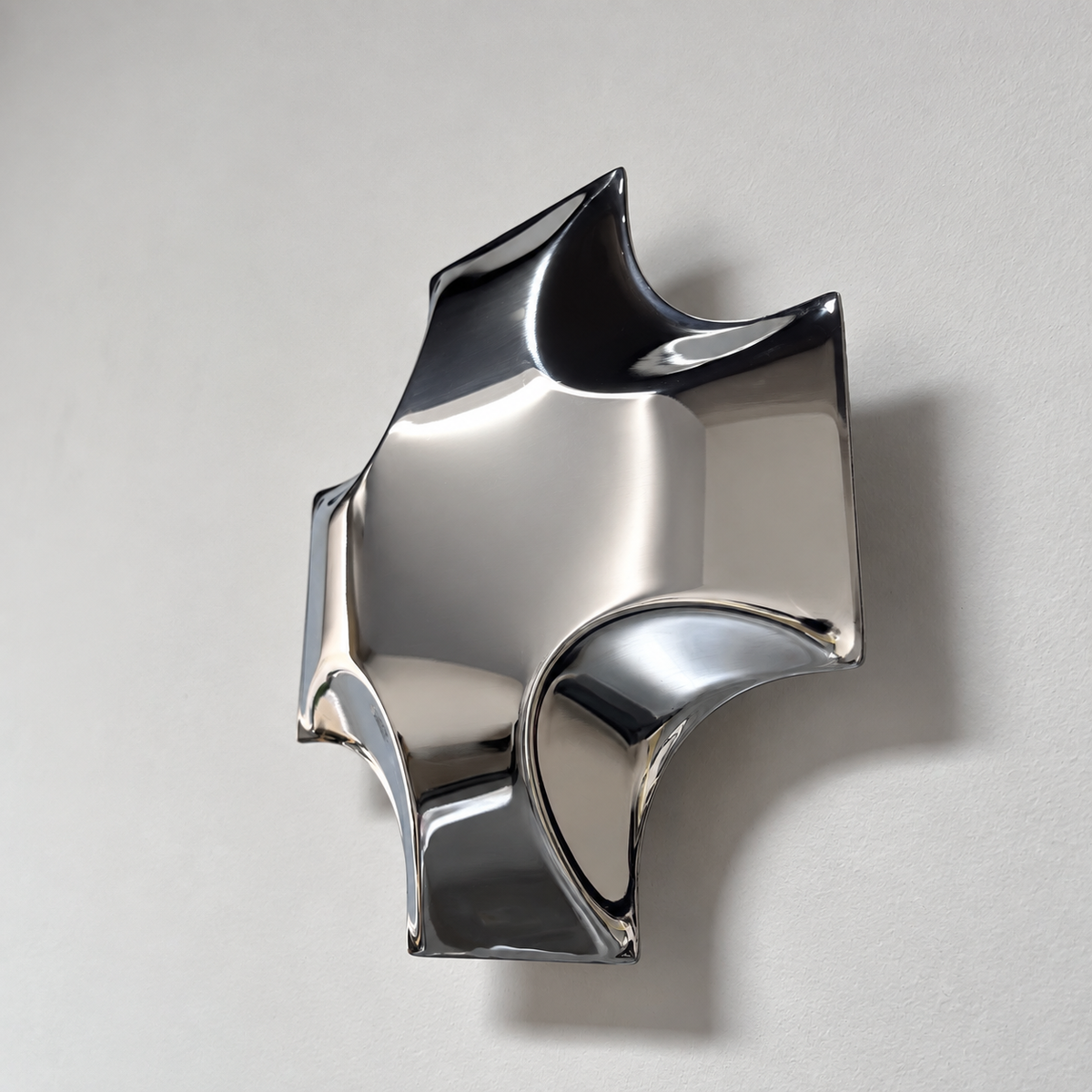 Quadra Wall Sculpture — mirror-finish stainless steel quatrefoil cross wall decor by AERIS LIVING (view 3)